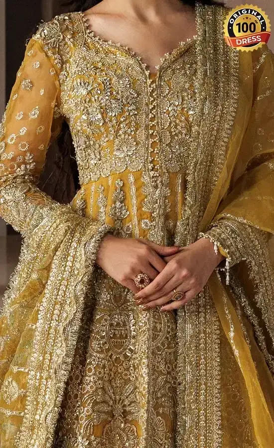Yellow cotton satin lehenga choli with hand embellished panels and embroidered sleeves