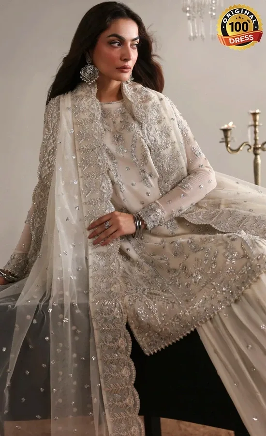 Embroidered white gharara suit for wedding guests with organza lace and hand embellished detailing