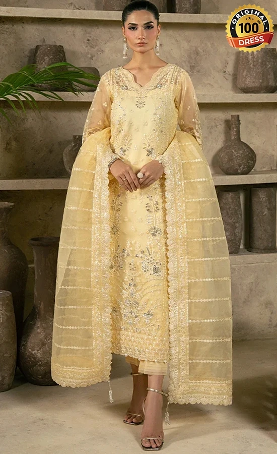 Pastel yellow salwar kameez for wedding guests with elegant embroidery and organza detailing