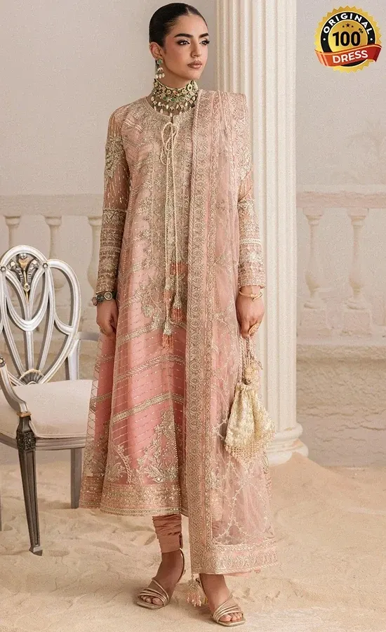 Pakistani peach shalwar kameez for wedding guests with floral patterns and detailed embroidery
