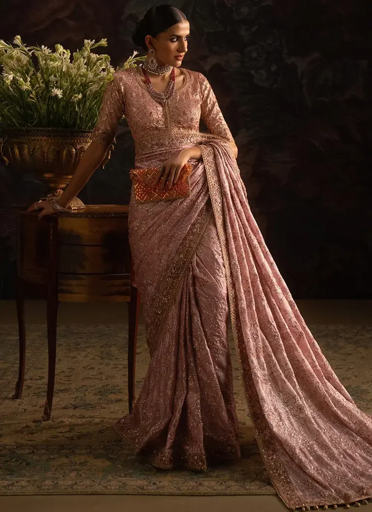 Pink colour saree blouse for wedding guests featuring elegant embroidery, patchwork and crystal tassel embellishments