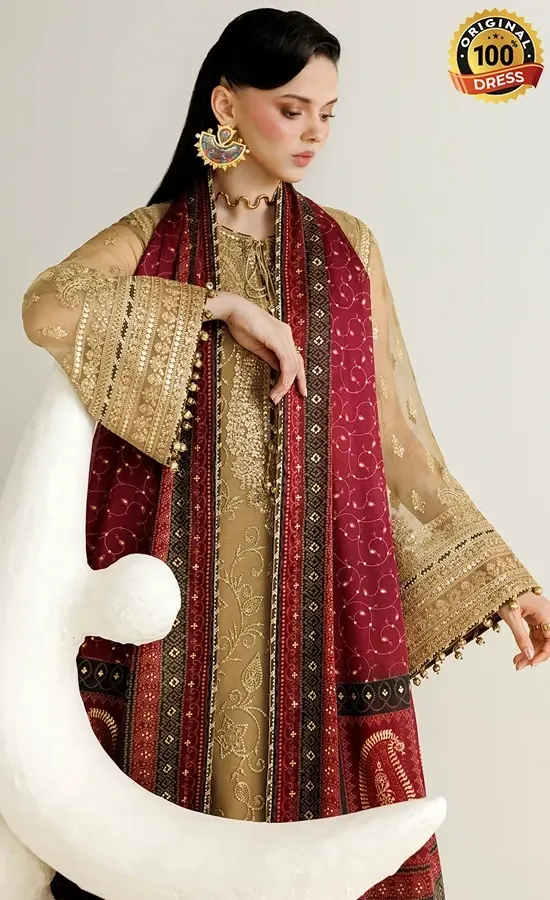 Embroidered brown salwar kameez for wedding guests with patchwork, tassels and floral detailing