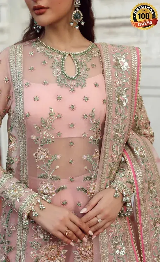 Pakistani pink Punjabi suit for wedding guests with embroidered organza and sharara styling