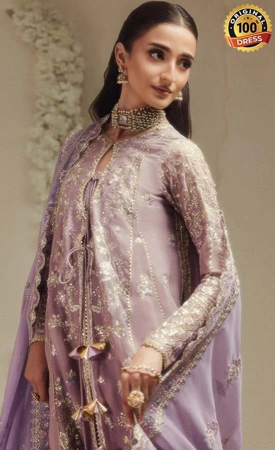 Pakistani purple sharara for wedding guests with intricate embroidery and traditional formal styling