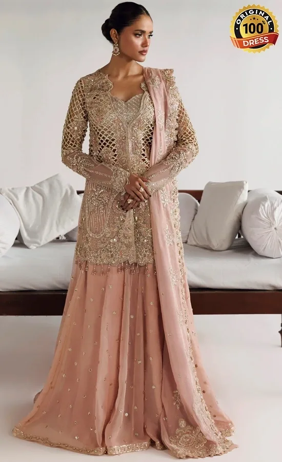 Peach Lehenga For Wedding Guests Peach lehenga for wedding guests with elegant embroidery and traditional detailing