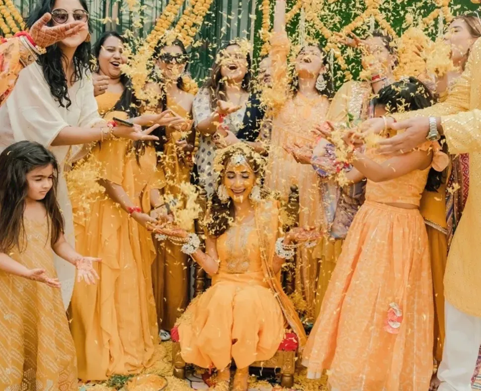 Haldi Tradition (Applying Tumeric Paste on the Bride's hands and feet)