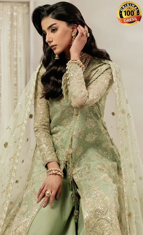 Sage green organza salwar kameez with samosa lace, patchwork and hand embroidery