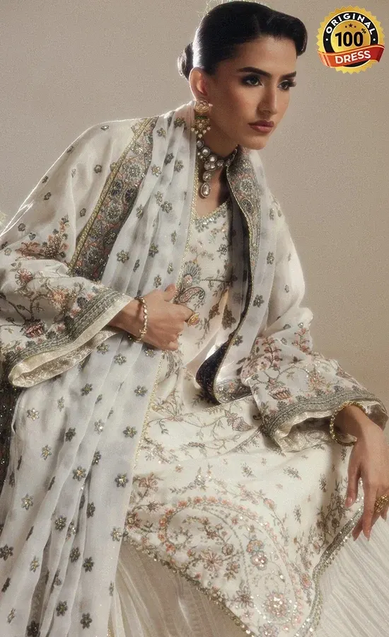 White medium silk sharara suit with hand embroidery, chatta patti and tassel finishing