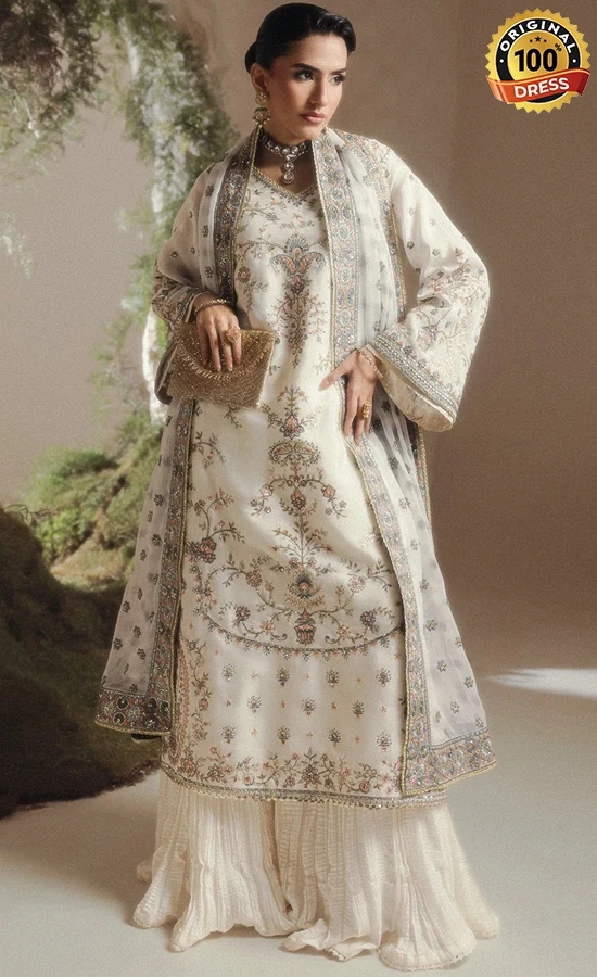 White sharara suit for wedding guests with elegant hand embroidery and silk detailing