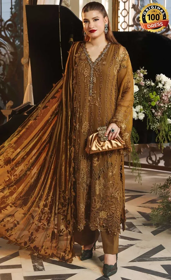Embroidered golden salwar suit for wedding guests with patchwork and tassel detailing