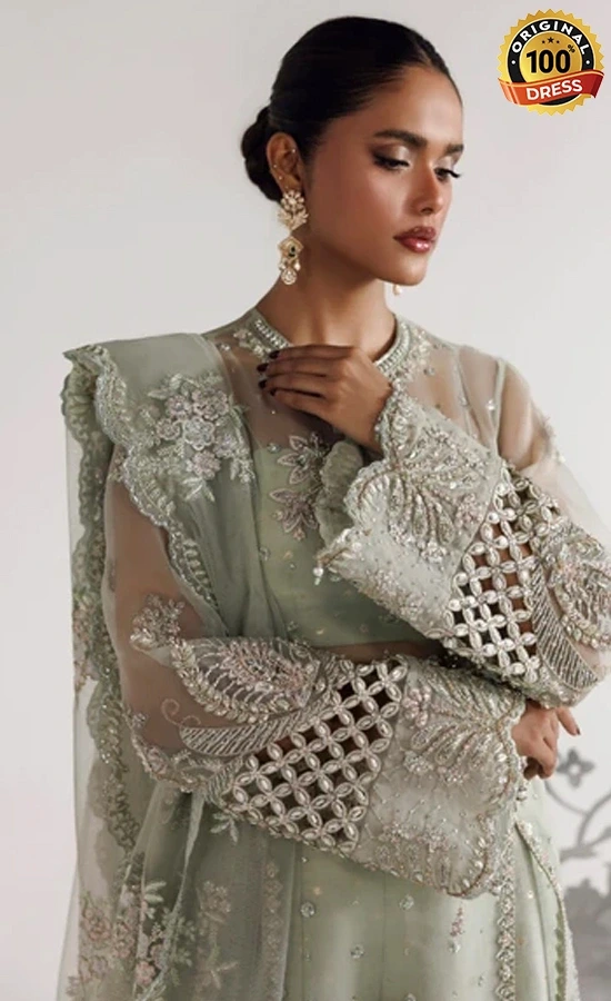 Sage green organza plazzo suit with hand embroidery and refined formal detailing