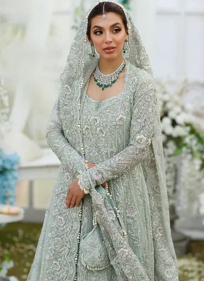 Three-piece aqua wedding dress with long frock, lehenga and 3.5-yard organza dupatta.