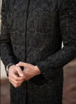 Close-up of black sherwani hand embroidery with sequins, pearls, kora dabka and machine threadwork
