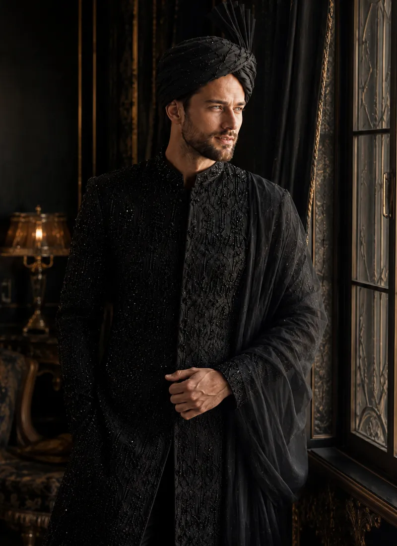 Black sherwani with black organza shawl and matching turban styled for a groom