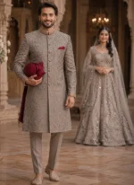 Full-length gray sherwani for groom with tonal hand embroidery, embellished buttons, matching trousers and khussa