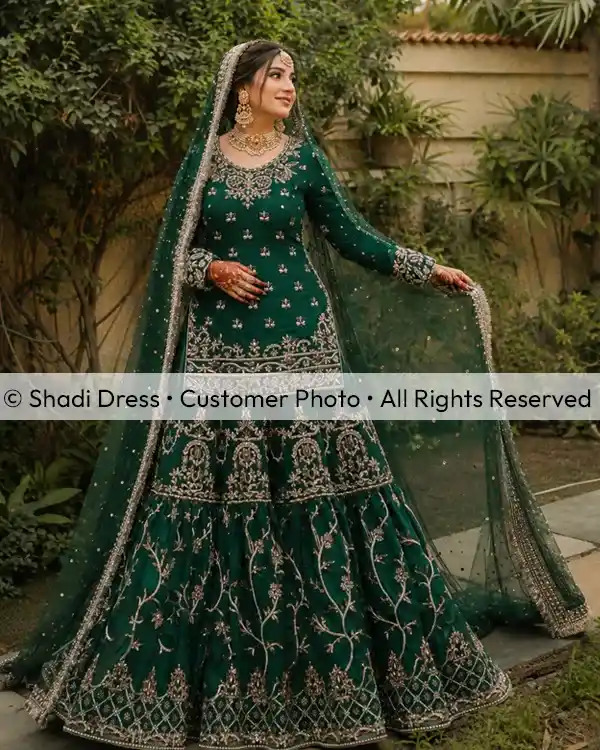 Real Shadi Dress bride wearing an emerald green embroidered Pakistani bridal dress with matching dupatta.