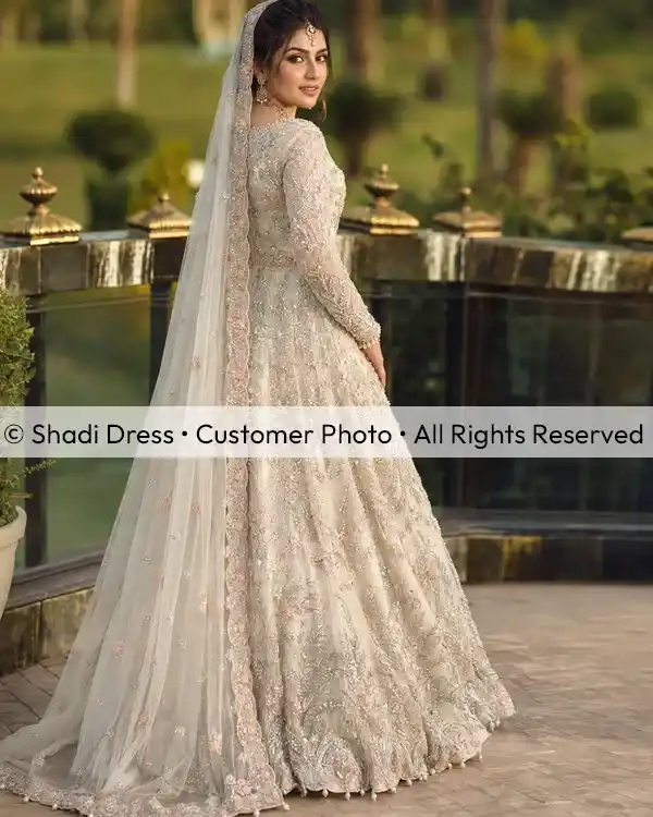 Real Shadi Dress bride wearing an ivory embroidered Pakistani bridal gown with a long matching dupatta.