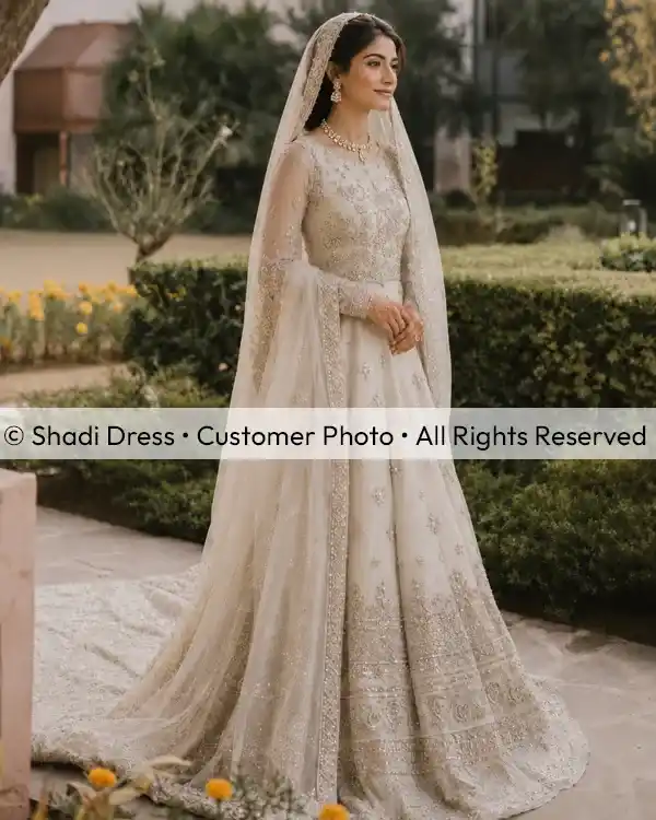 Real Shadi Dress bride wearing an ivory white embroidered Pakistani bridal dress with a long matching dupatta.