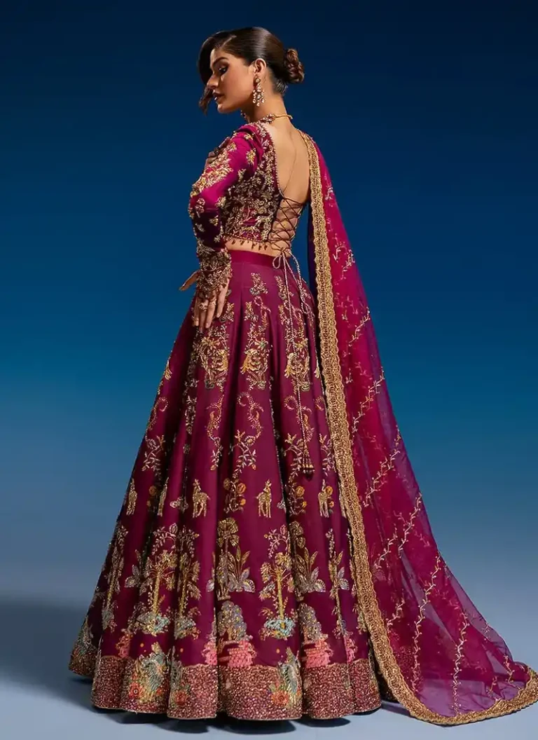 Burgundy bridal lehenga choli with intricate hand embroidery and traditional Eastern bridal detailing