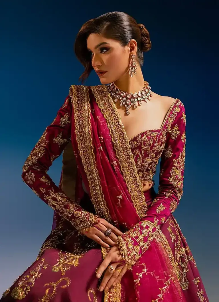 Embroidered burgundy lehenga choli for Nikkah ceremony with handcrafted embellishments and graceful bridal styling