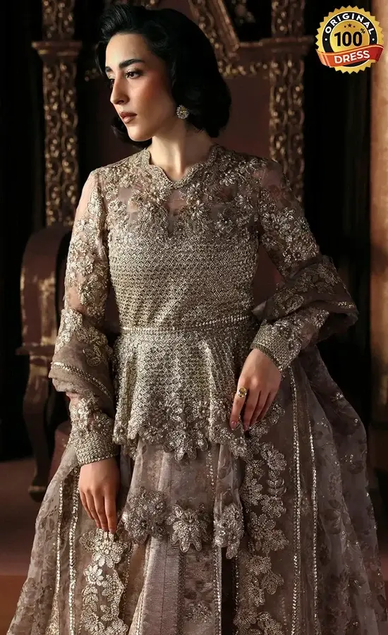 Embroidered champagne lehenga for wedding guests with sequinned work and delicate lace detailing