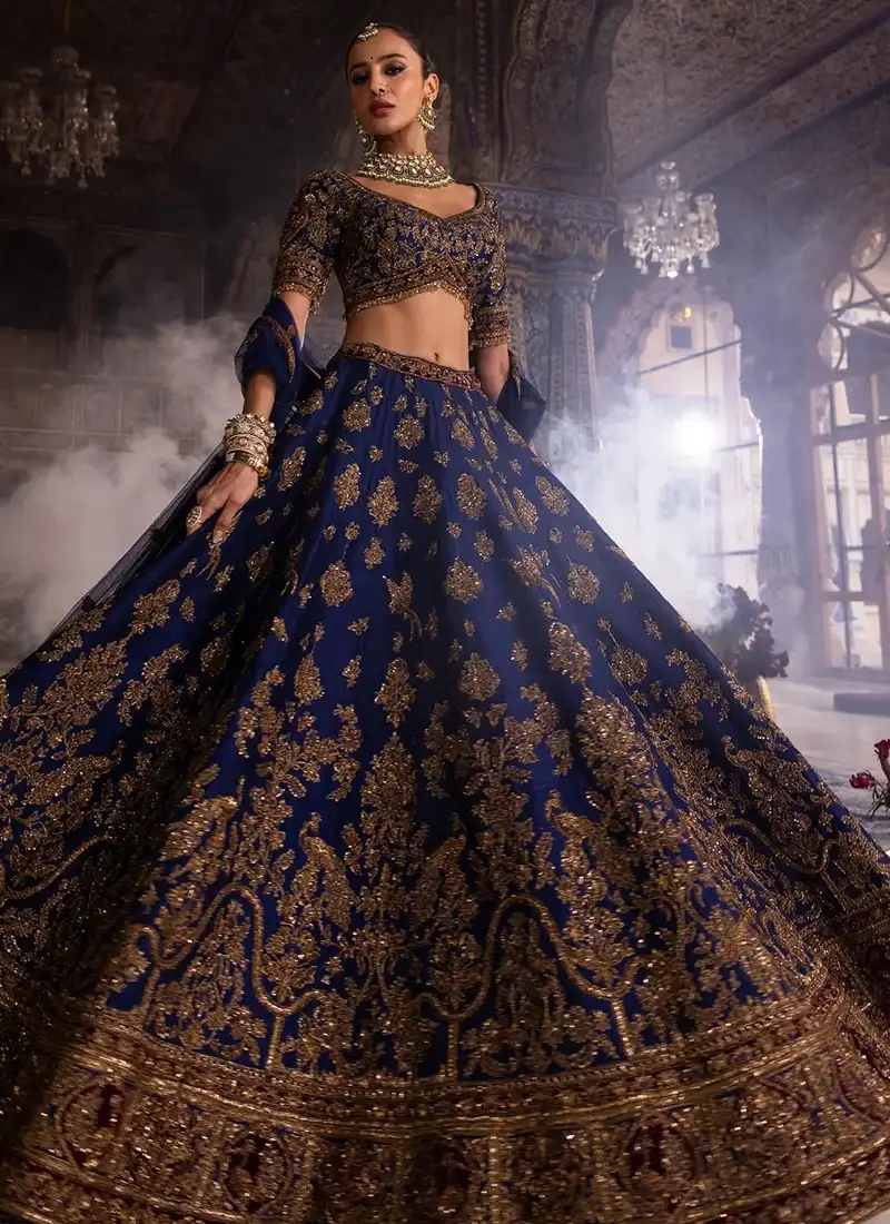 Navy Blue Wedding Lehenga with Peacock Embroidery Navy blue wedding lehenga with peacock embroidery and rich traditional gold embellishments