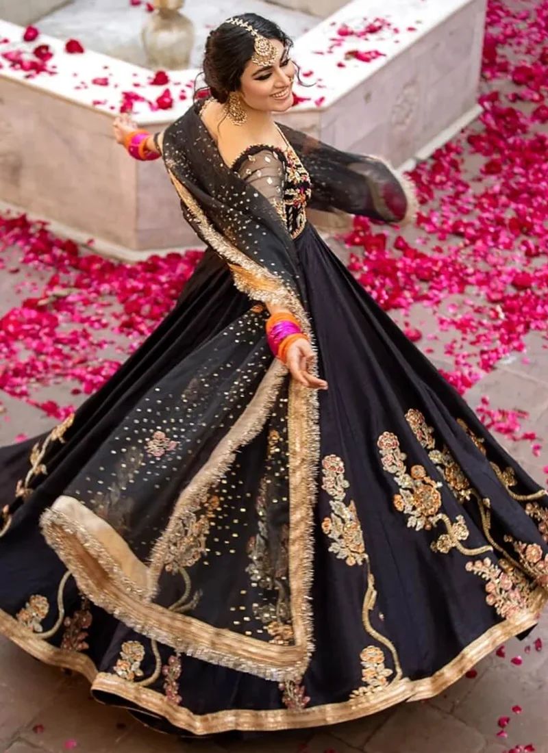 Black pishwas back view with a deep round neckline and central embroidered motif