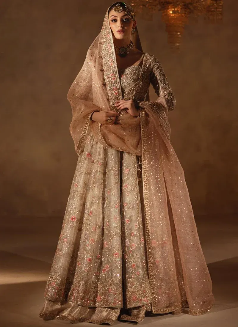 Champagne Walima Long Peshwas with Lehenga with Angrakha Wrap Bodice Champagne bridal angrakha bodice close-up with strappy sweetheart blouse and gold floral embroidery