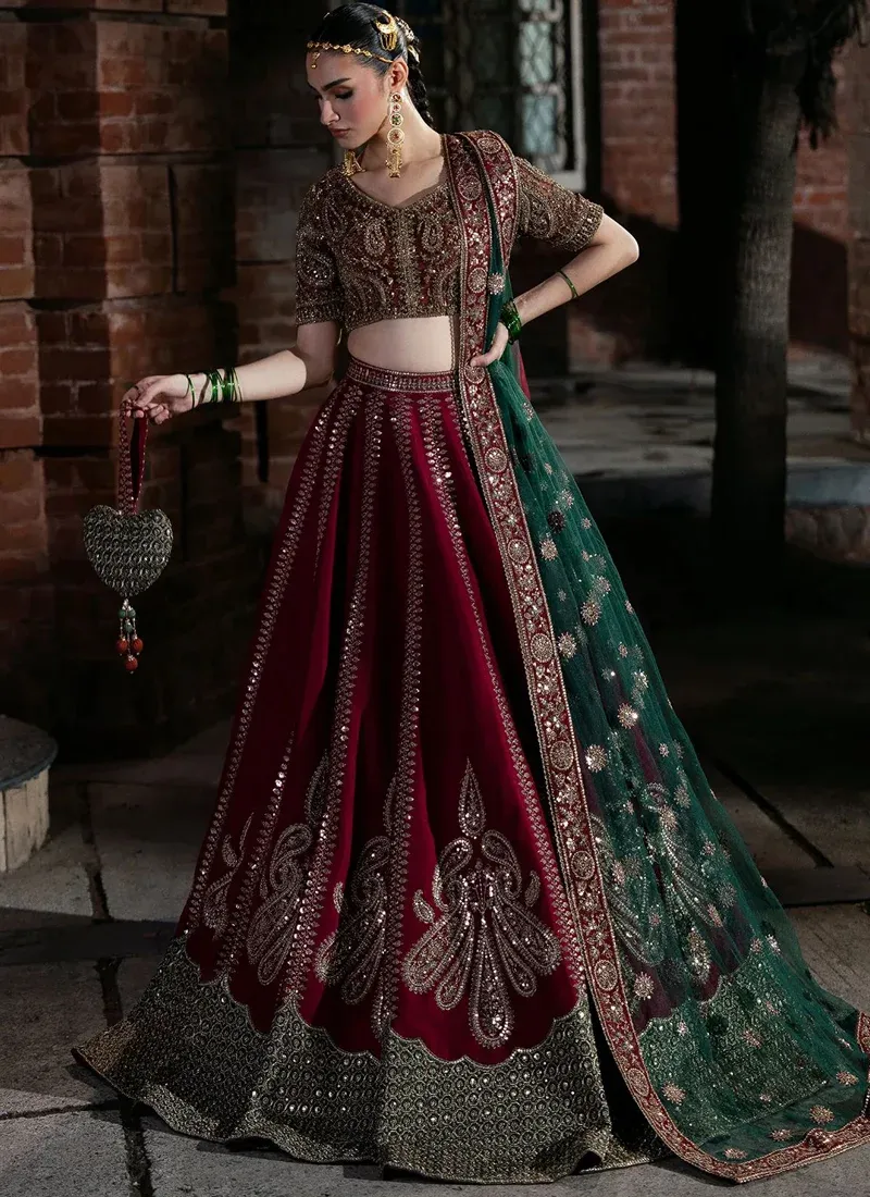 Hot pink bridal lehenga choli, back view with deep round blouse neckline and embroidered teal dupatta