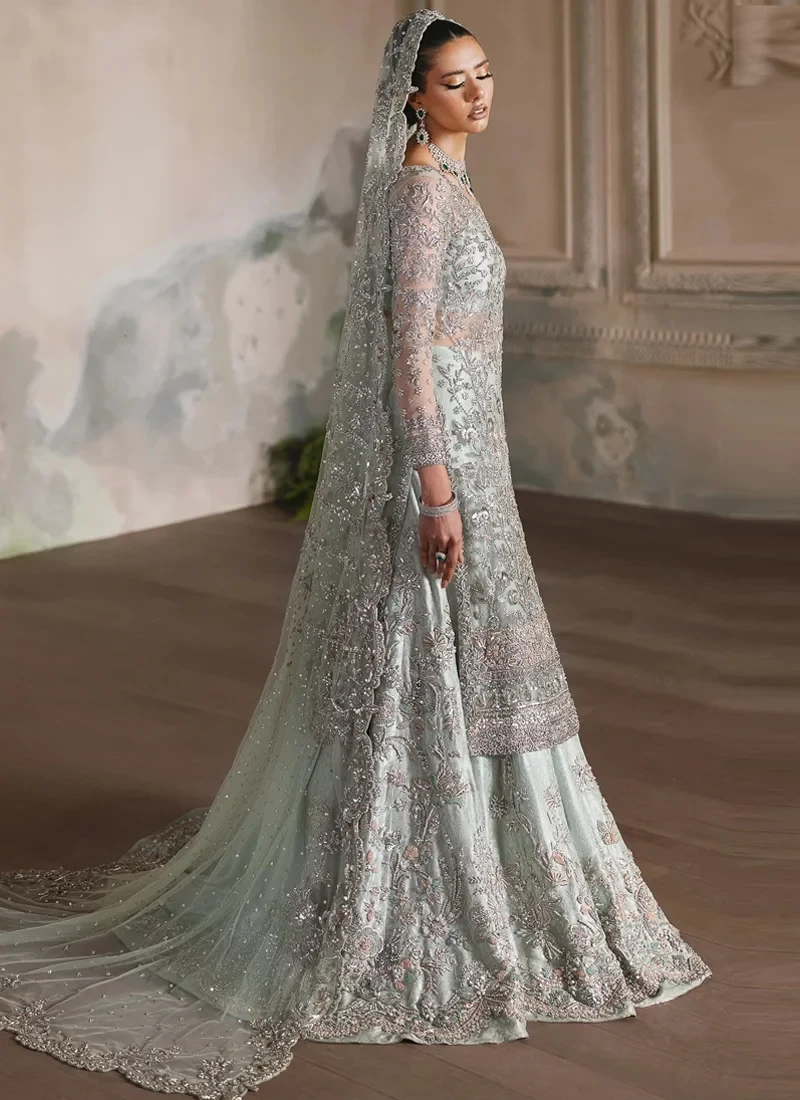Ice blue bridal long shirt with lehenga front view showing sheer embroidered sleeves and a scalloped net dupatta