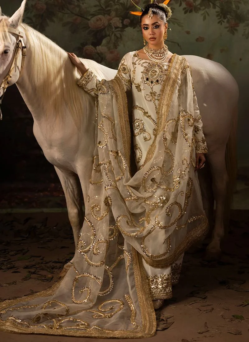 Ivory shalwar kameez front view with gold embroidered kurti and sweeping organza dupatta with scrollwork
