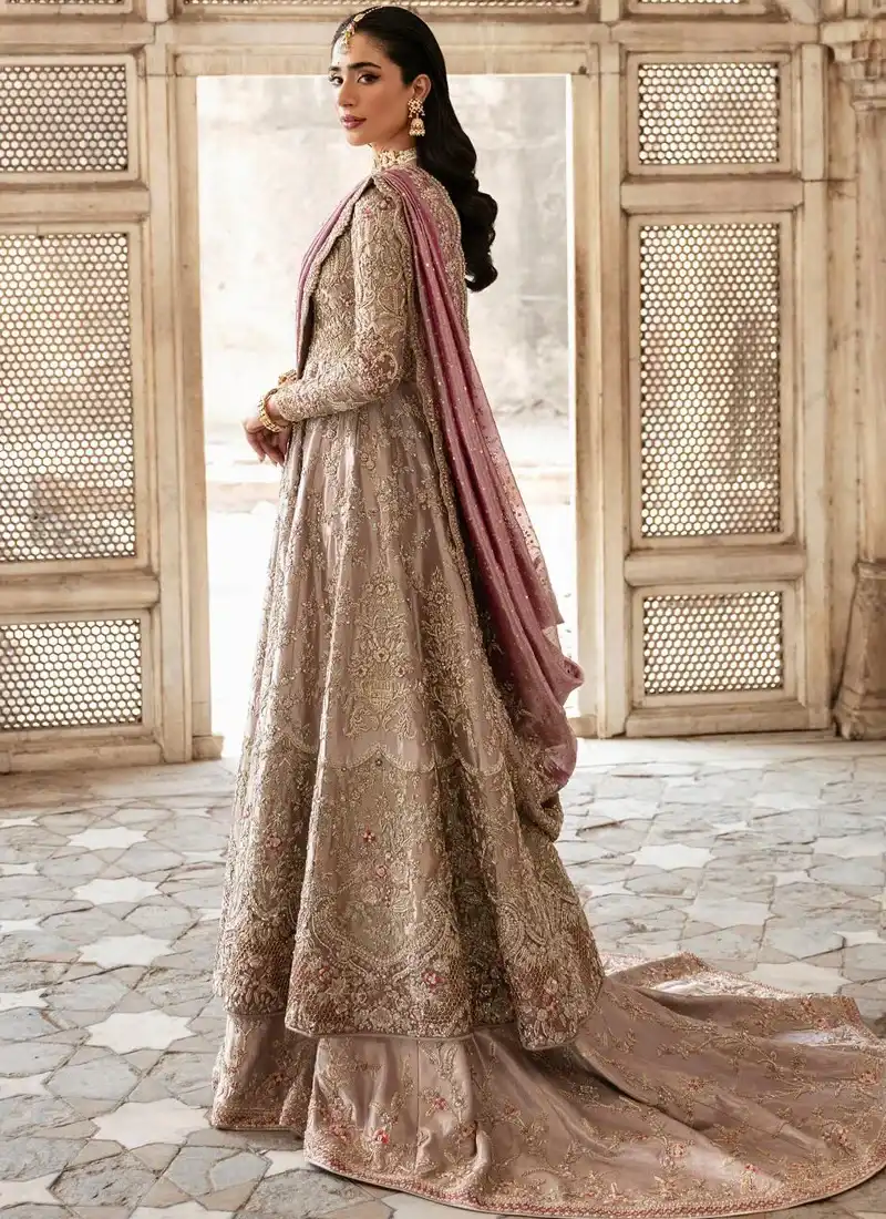 Mushroom lilac bridal farshi lehenga from the back with a sweeping embroidered trail and mauve dupatta