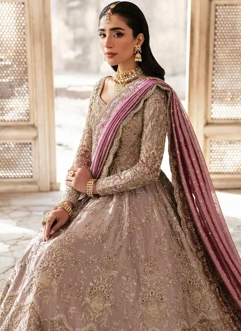 Mushroom lilac bridal frock in seated view with gold floral motifs across the flared skirt