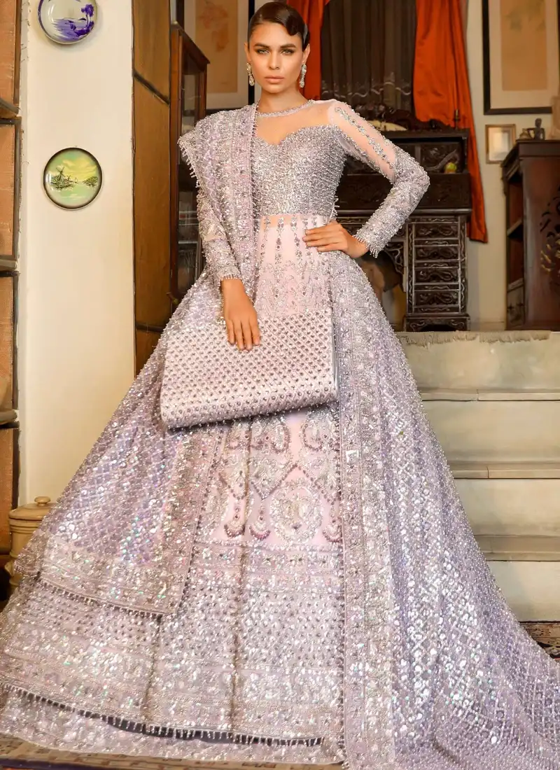 Lilac Walima Gown with Ruffled Lehenga Trail Lilac bridal gown seated view with silver paisley embroidery and a sweeping pink ruffled lehenga trail