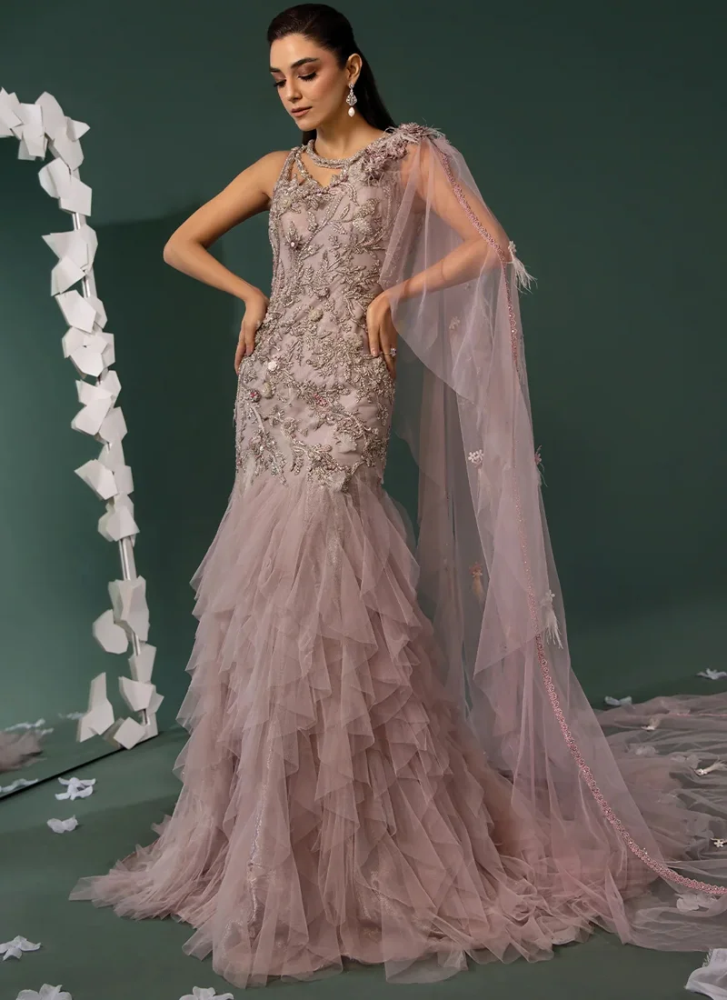 Mauve Walima Gown with Feathered Sheer Cape Dusty mauve mermaid gown in angled full-length view, with silver floral embroidery and a sweeping sheer cape