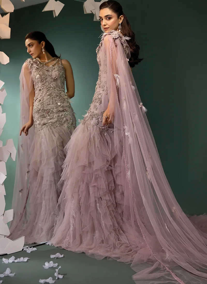 Dusty mauve gown shoulder close-up, showing sheer cape, lace edging and feather-tasselled floral motifs