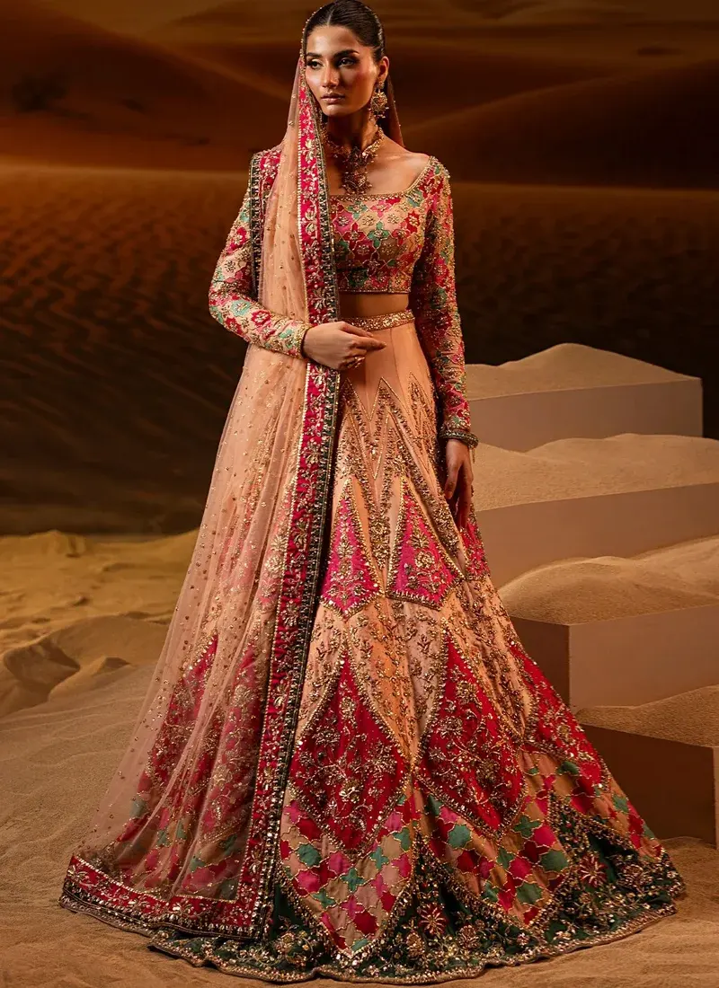 Peach Baraat Lehenga Choli with Chevron Floral Panels Peach and hot pink bridal lehenga choli front detail with gold floral embroidery and a wide scoop neckline