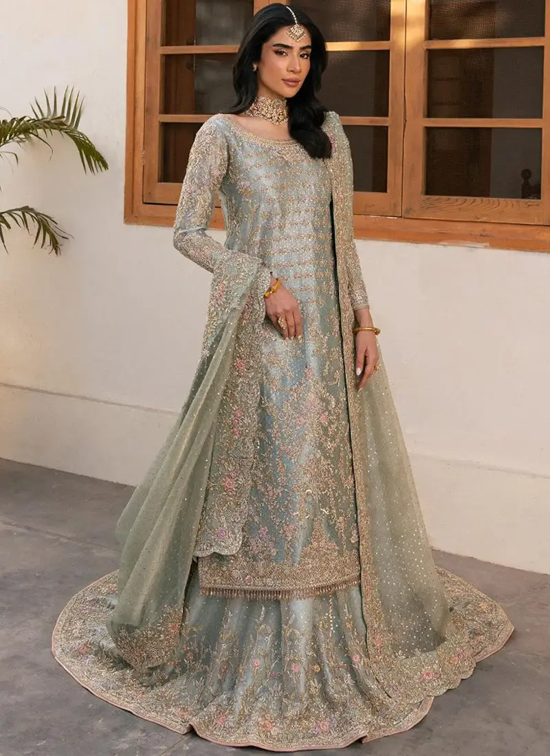 Powder Blue Nikkah Long Shirt with Lehenga with Scalloped Floral Dupatta Powder blue Nikkah long shirt with farshi lehenga, full front view showing floral embroidery and sweeping skirt hem.