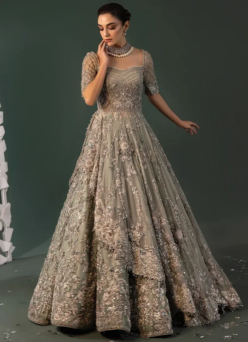 Sage Green Walima Gown with Chevron Beaded Bodice Sage green bridal gown front view featuring a chevron-beaded bodice and densely embroidered dupatta borders.