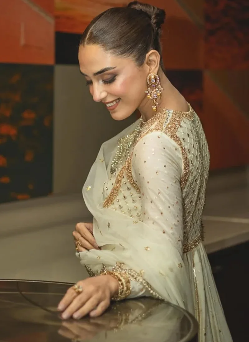 White and gold pishwas full-length front view with wide flared skirt, striped gold hem and scalloped dupatta