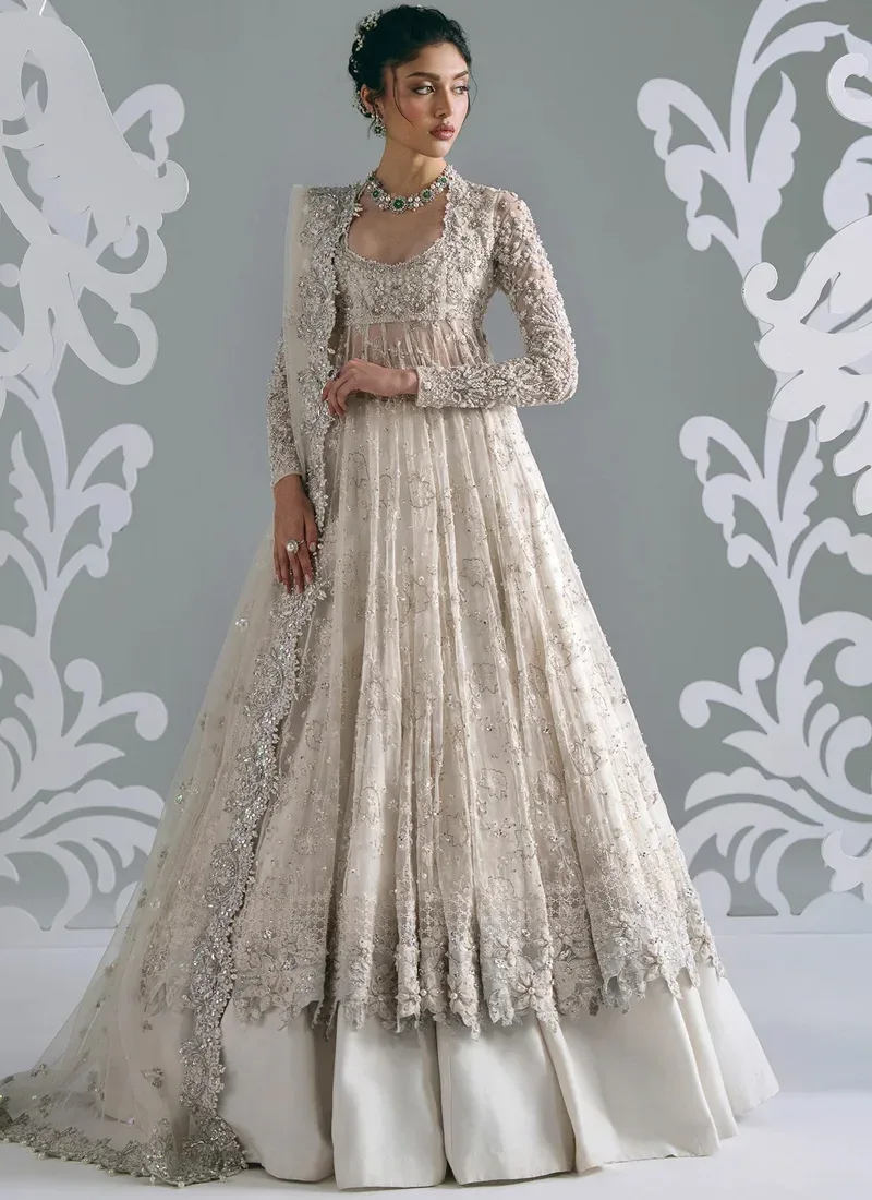 White Nikkah Frock with Lehenga White Nikkah frock with ivory lehenga, front view showing silver embroidery and scalloped floral hem