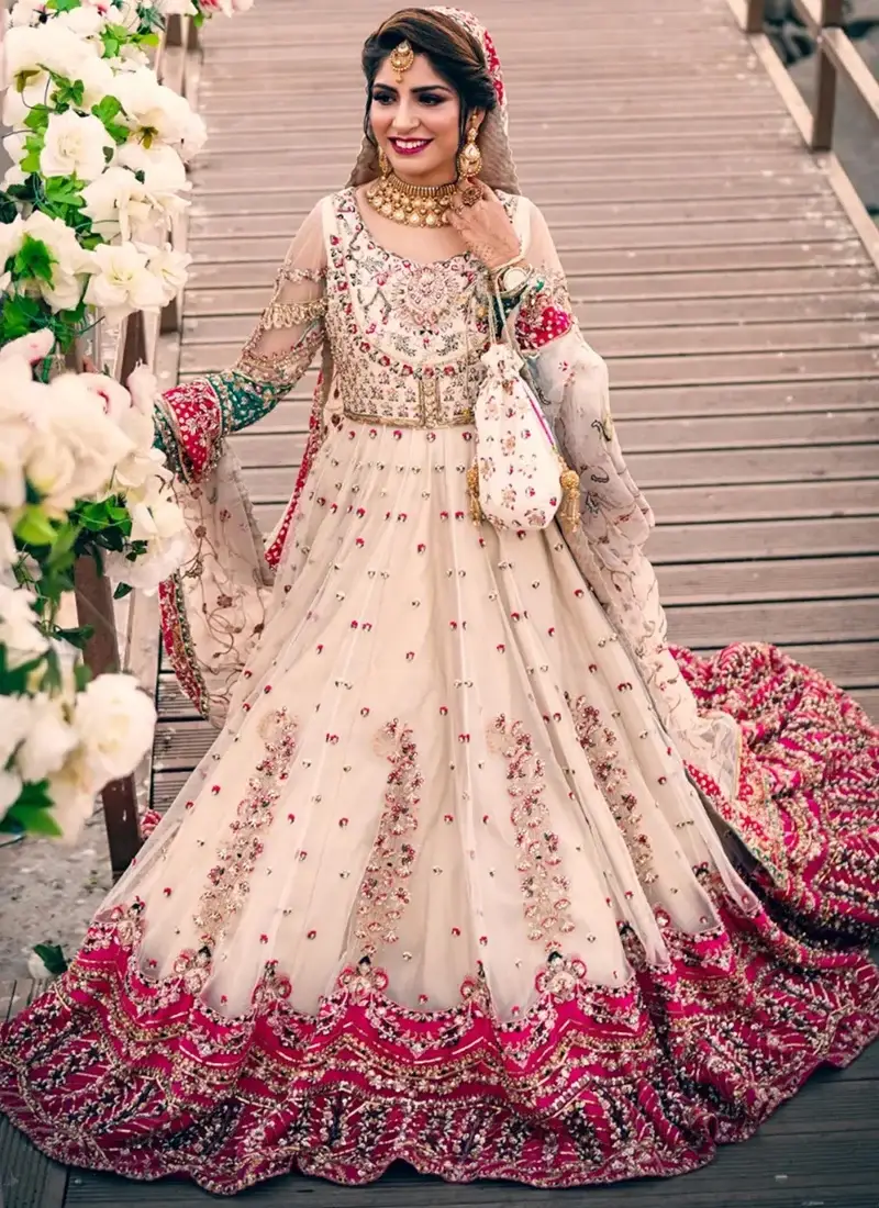 White Nikkah Gown with Scalloped Fuchsia Floral Hem White and pink Nikkah gown, full front view with scalloped fuchsia floral hem and embroidered net dupatta